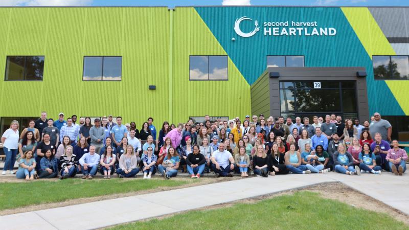 Second Harvest Heartland employees gather in front of headquarters