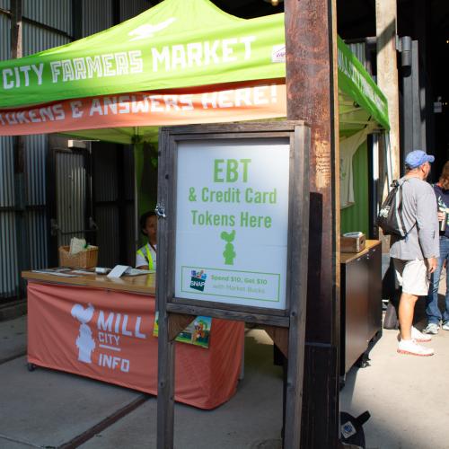 A Market Bucks sign at a Farmers Market