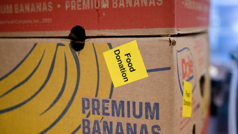 Food donation box A box with a picture of bananas on it with a "food donation" sticker