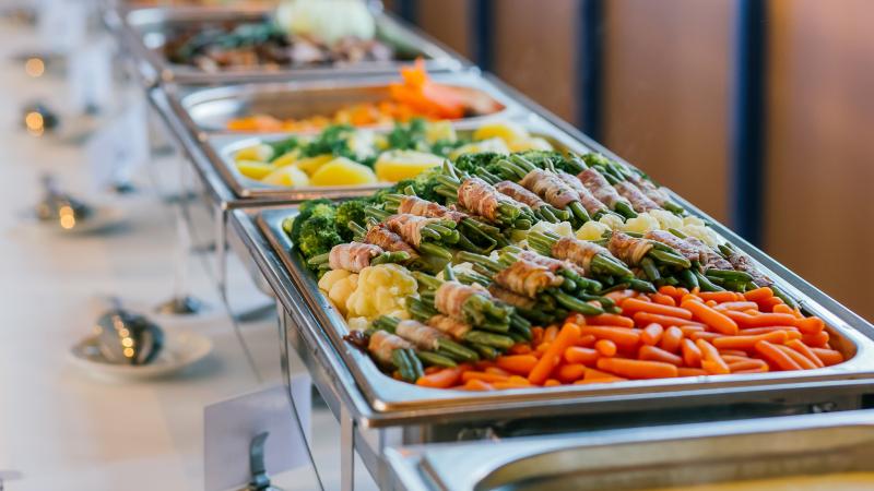 pans of prepared and catered food