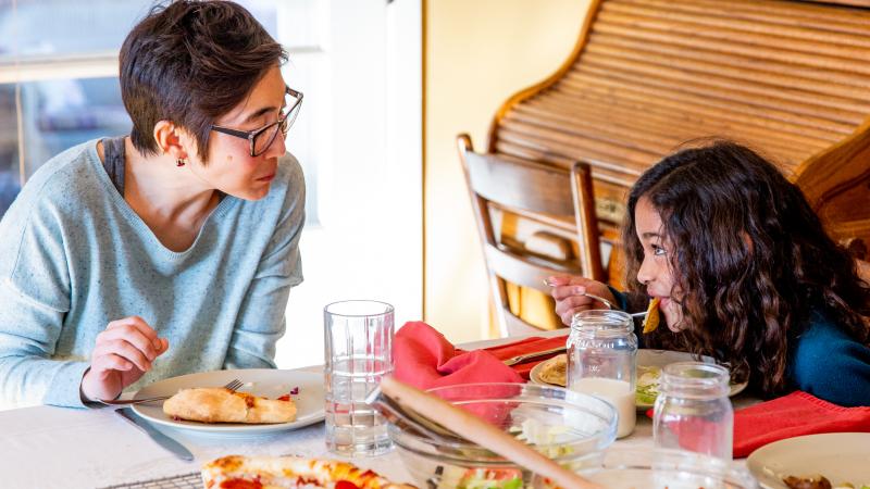 mom and kid eating at table mom and kid eating at table