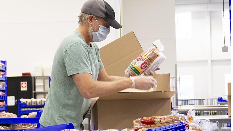 Man packing bread Man packing bread