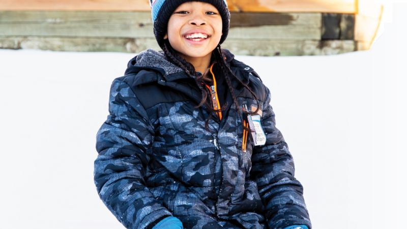 Boy playing in the snow