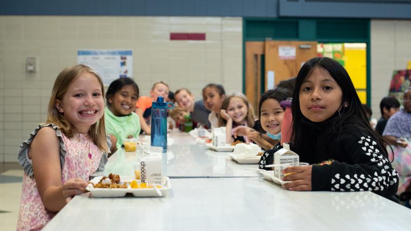 Children at lunch table at school