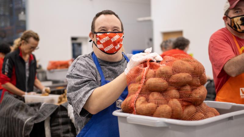 Volunteer packing potatoes