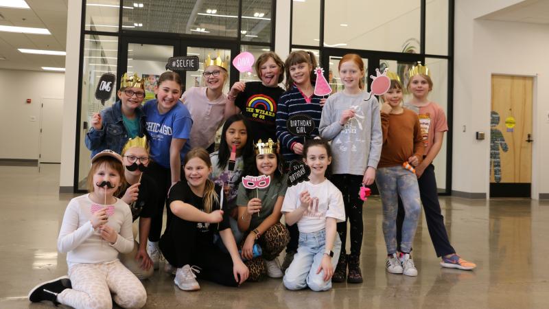 A group of girls volunteering at Second Harvest Heartland for Charli's birthday