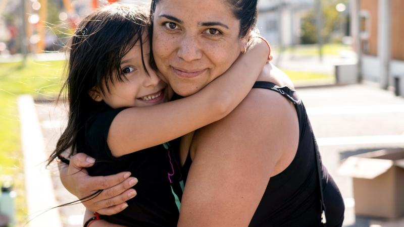 Mother and daughter hugging
