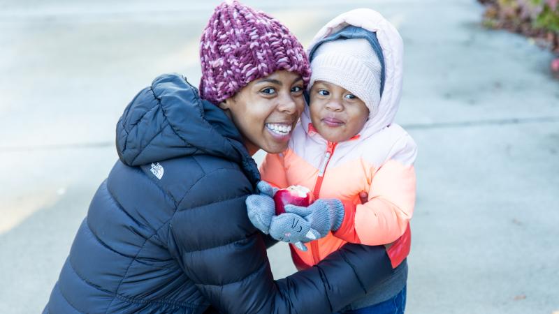 Woman hugging her young child