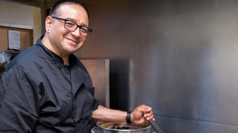 Person in cooking in kitchen