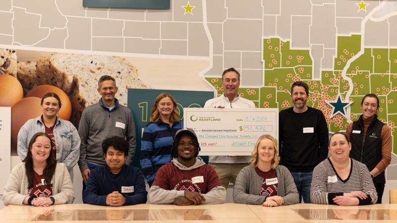A check presentation at a food bank
