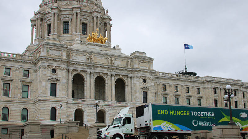 A Second Harvest Heartland semi truck in front of the Minnesota State Capitol building