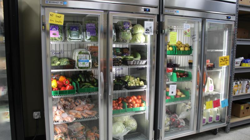 Refrigerators full of produce at a food shelf