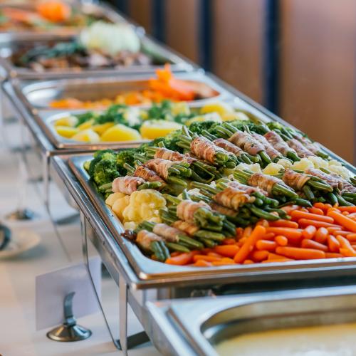 pans of prepared and catered food