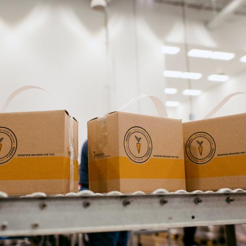 Boxes on a conveyor in a warehouse.