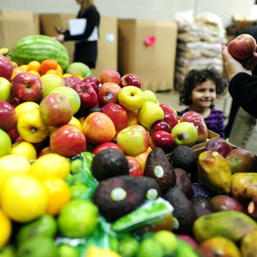 produce with kid in background
