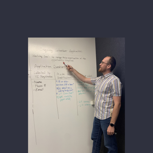 Volunteer at a white board