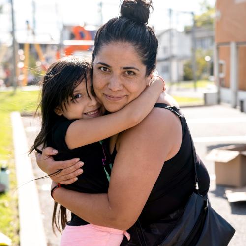 Mother and daughter hugging