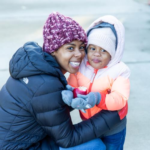 Woman hugging her young child