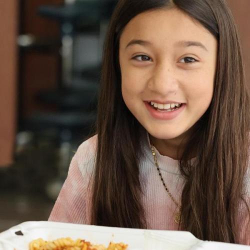 Student eating a school lunch