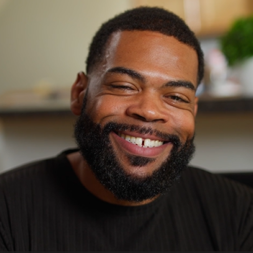 A man smiling at the camera
