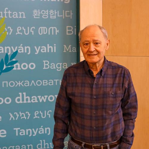 A volunteer stands in our Welcome Center
