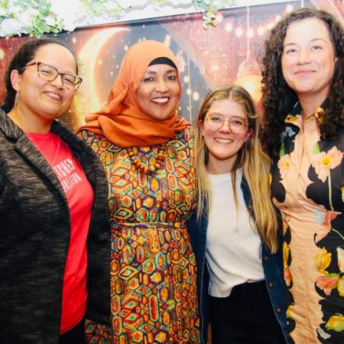 Kitchen Coalition staff and Amina gather for a group photo