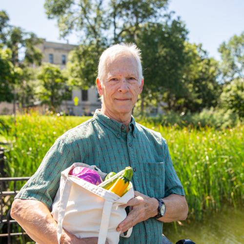 Senior with bag of groceries