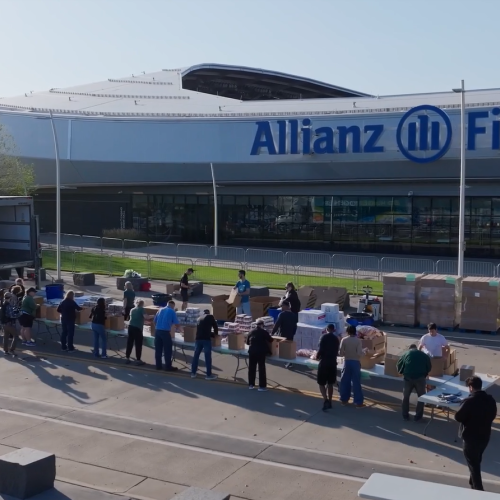 Volunteers packing food boxes outside Allianz Field