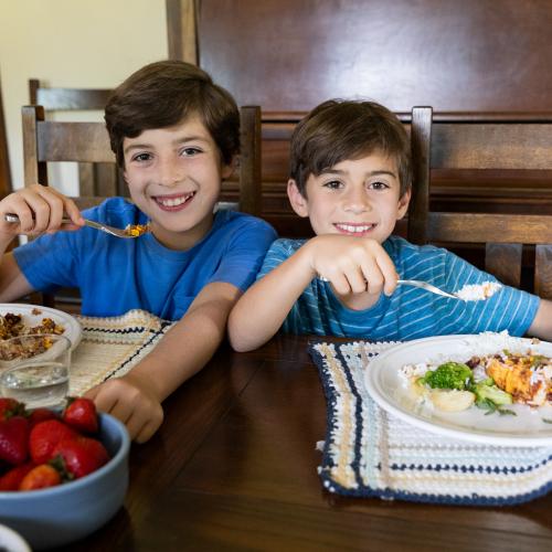 Two Children sitting at table