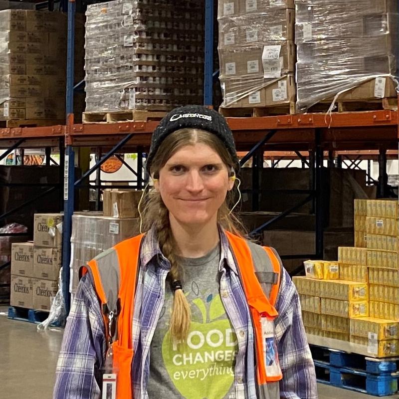 Addison in food bank warehouse