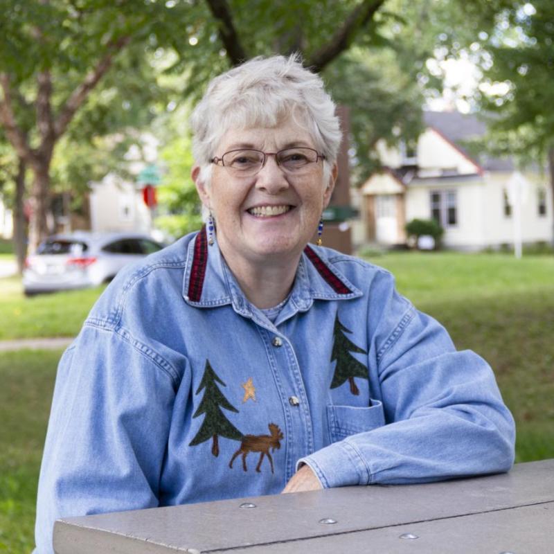 Woman sitting at a picnic table