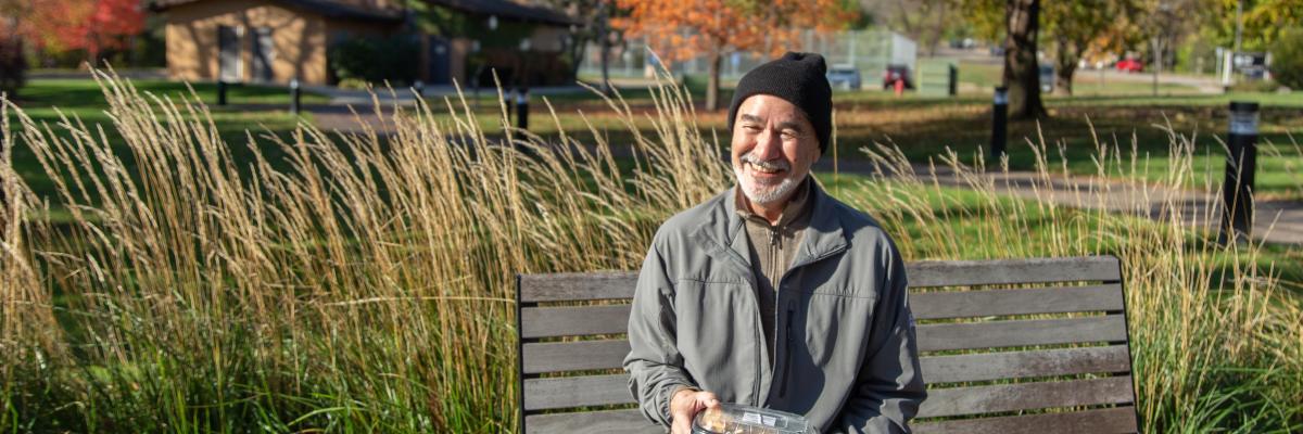 Man with Prepared Meal on Bench