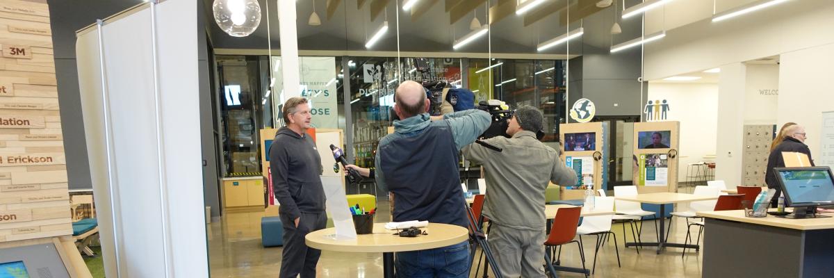 Coach Finch getting interviewed in the welcome center