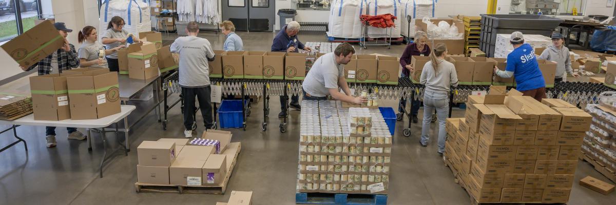 Volunteers packing food at the Volunteer Center