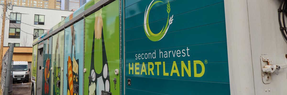 Food distribution truck in front of the Minneapolis skyline