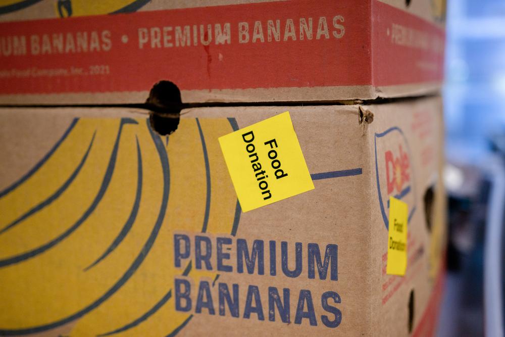 Food donation box A box with a picture of bananas on it with a "food donation" sticker