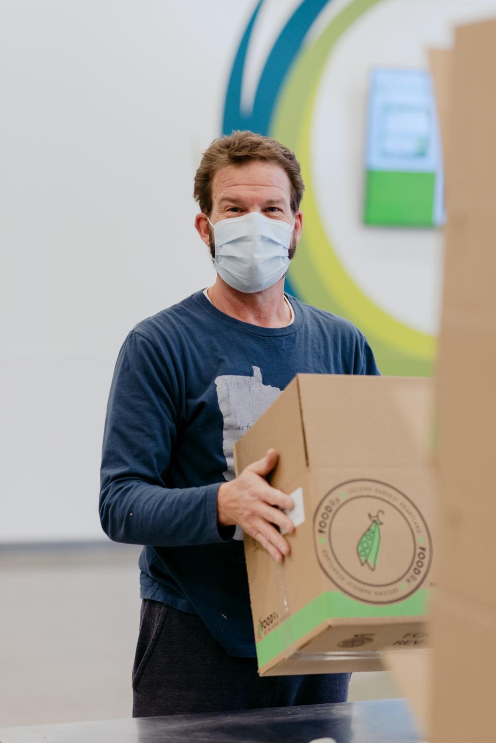 Man holds FOODRx box