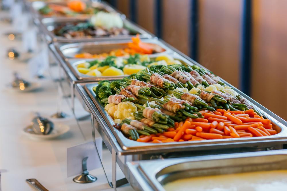 pans of prepared and catered food