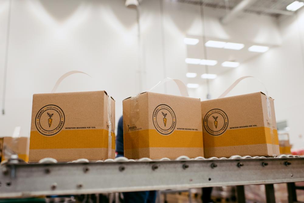 Boxes on a conveyor in a warehouse.