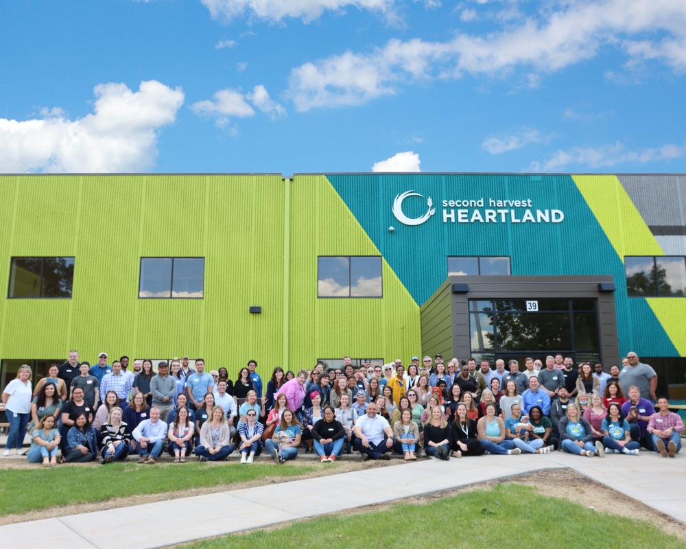 Second Harvest Heartland employees gather in front of headquarters