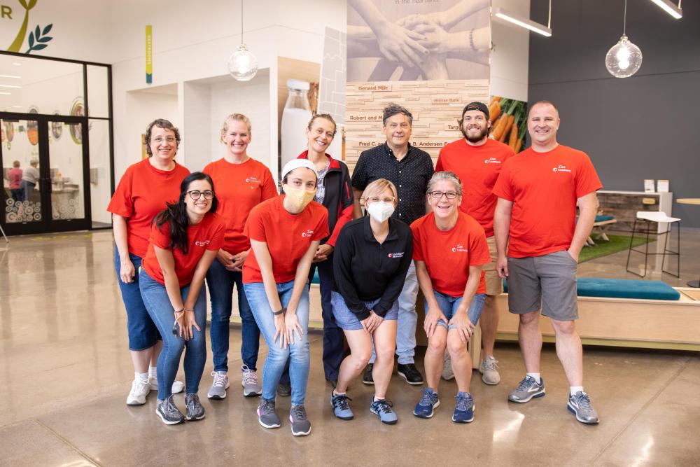 A group of volunteers poses in the Volunteer Center