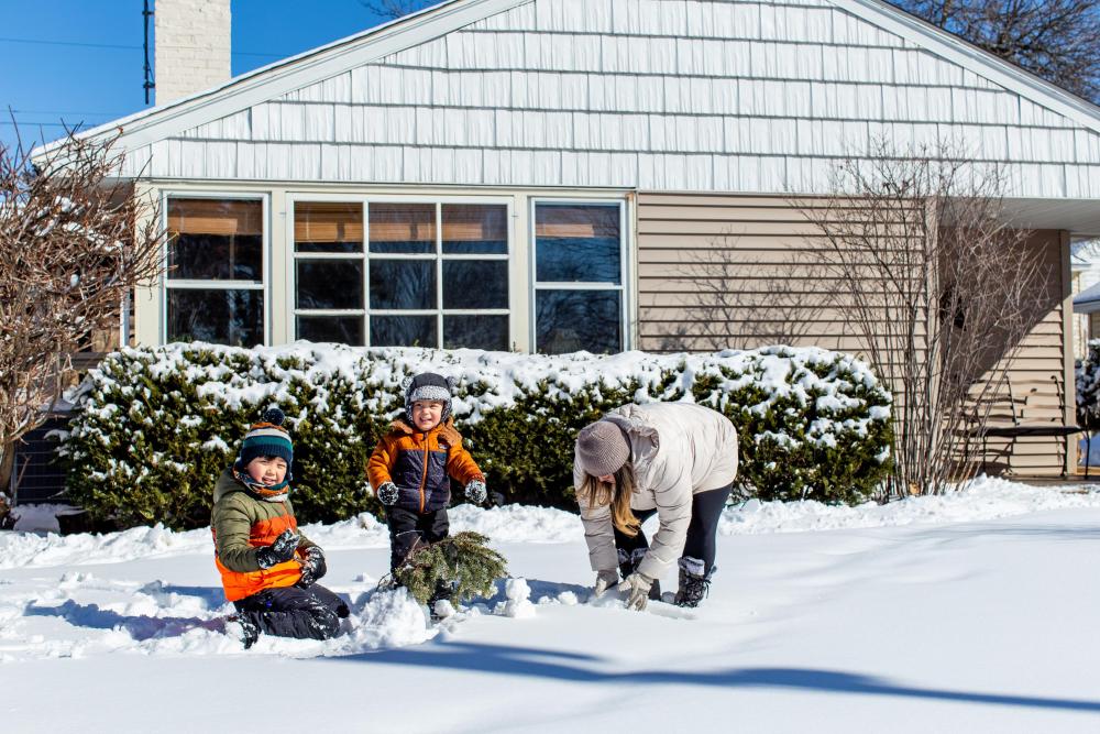 Family in front of home