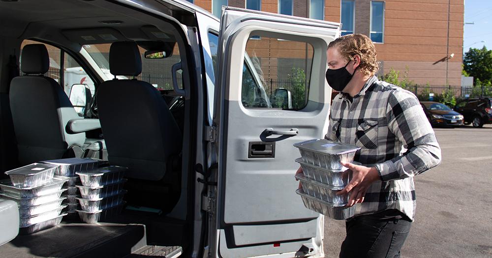 Loading meals into delivery Loading meals into delivery