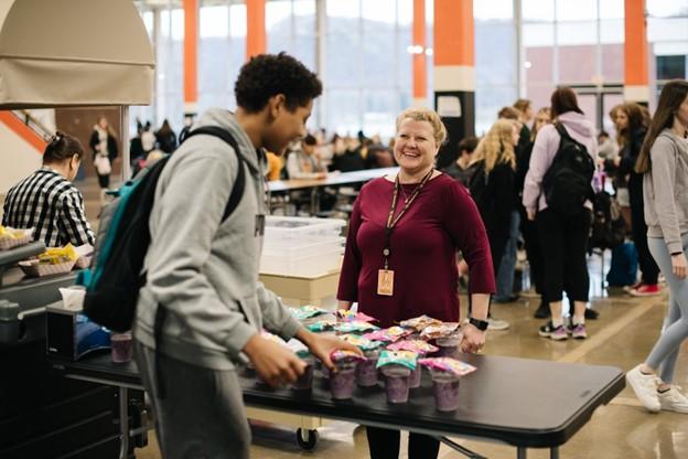 Winona Area Public Schools’ Nutrition Director Jennifer Walters oversees grab-n-go breakfast distribution at Winona Senior High School.