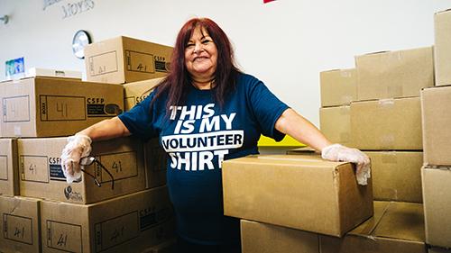 volunteer with boxes volunteer with boxes