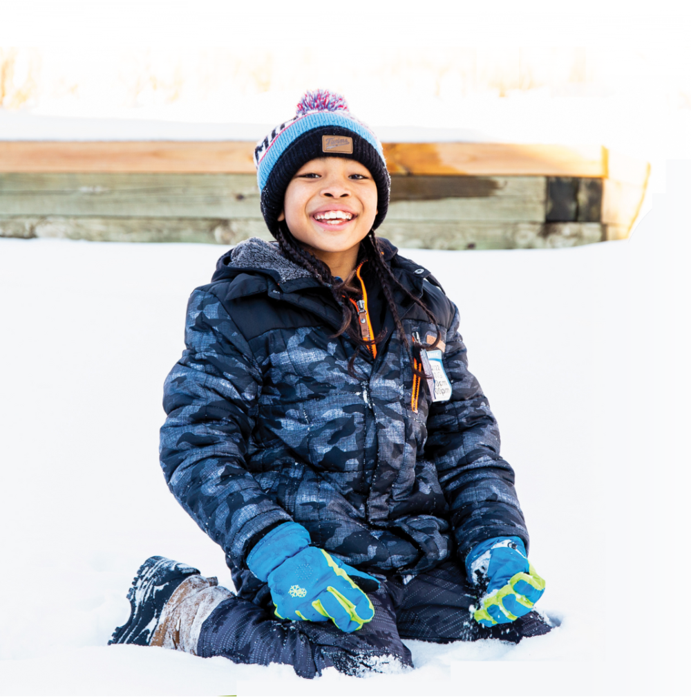 Boy playing in the snow