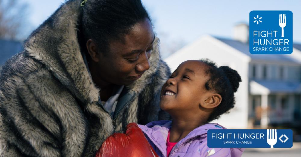 Mom hugging daughter - looking at each other smiling