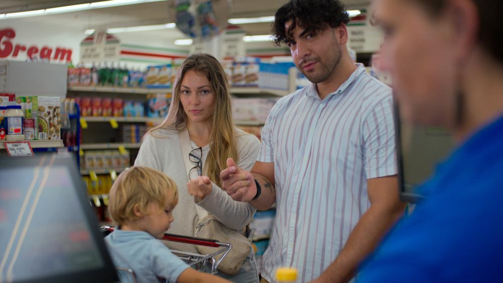 Family getting groceries at a store