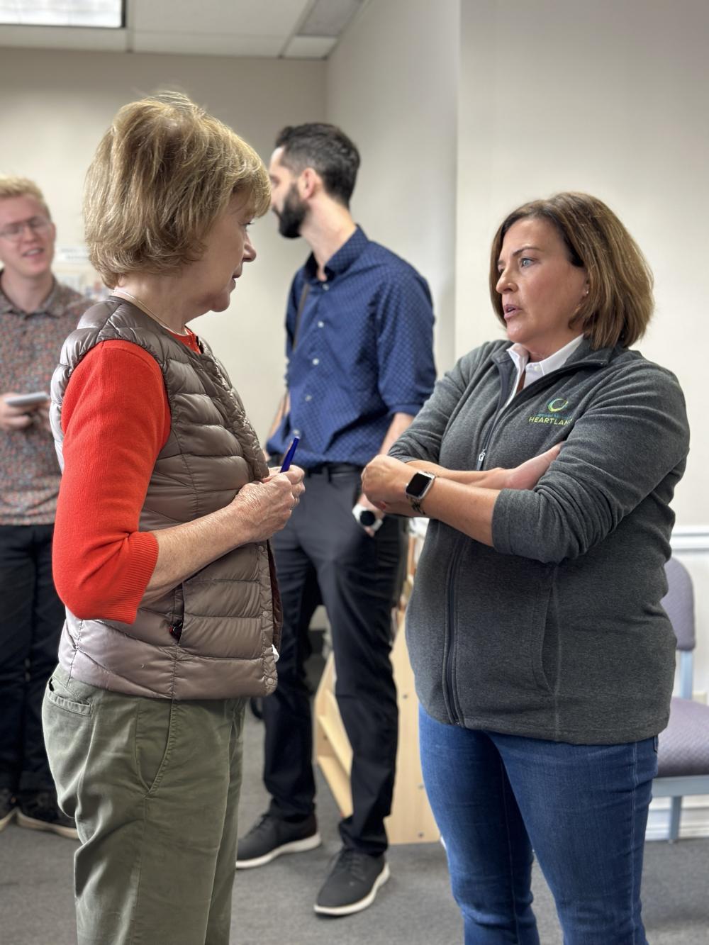 Allison O'Toole speaking to Senator Tina Smith