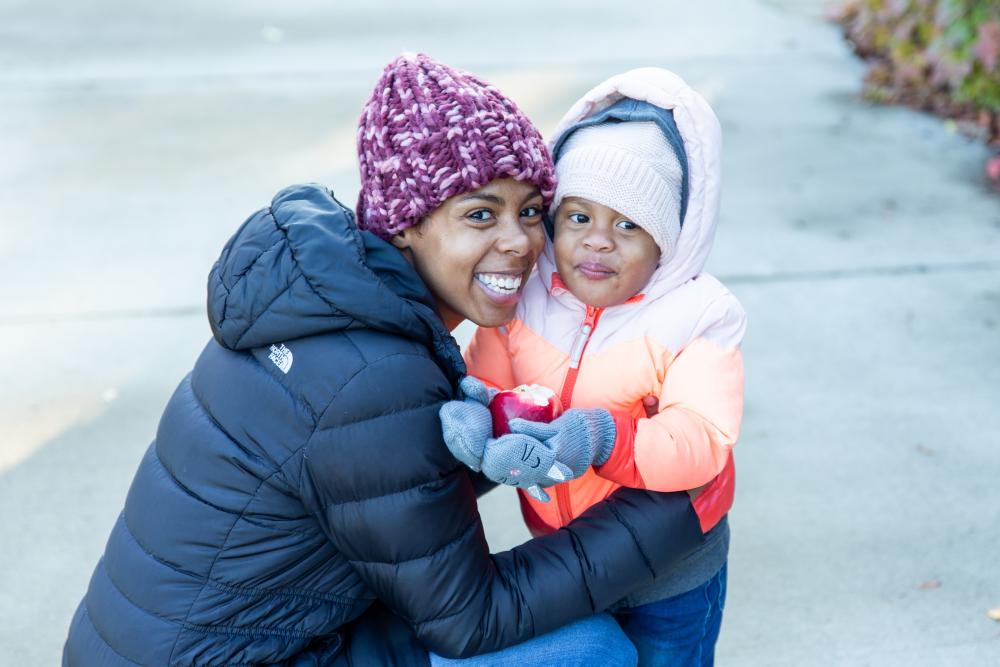 Woman hugging her young child